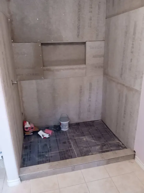 Cement board and the tiled shower pan before waterproofing